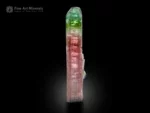 9 cm elongated bi-color tourmaline crystal with pink and green color zoning, doubly terminated, from Paprok Valley, Afghanistan.