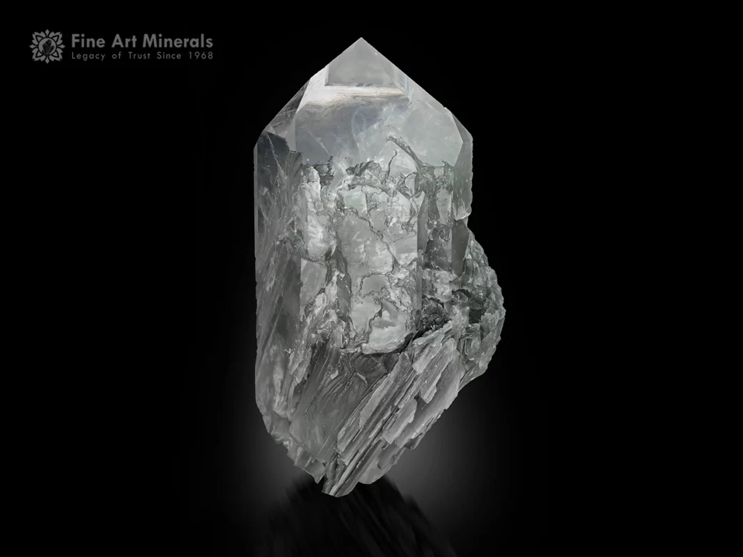 Quartz crystal with chlorite and fibrous Byssolite inclusions and pointed termination.