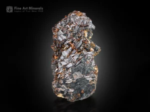 Reddish-brown elongated rutile crystal cluster with metallic luster.