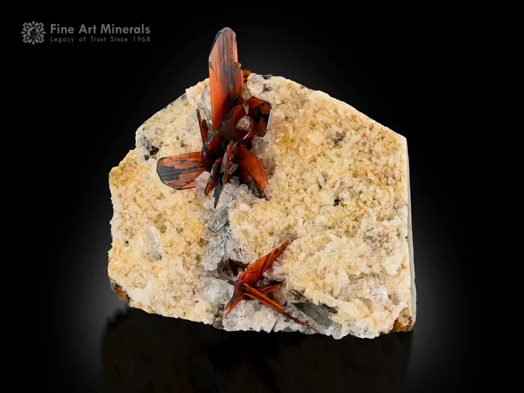 Red brookite crystal cluster on quartz matrix showing sharp form and strong contrast.