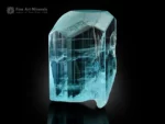 Transparent aquamarine crystal with etched termination and glassy luster