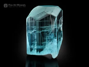 Transparent aquamarine crystal with etched termination and glassy luster