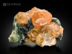 Honey orange hessonite garnet crystals with green muscovite on matrix from Pakistan