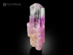 Kunzite crystal from Afghanistan with lilac color, natural colorless zones, and superb luster displayed against a black background