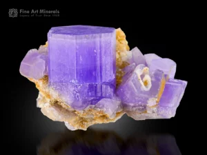 Purple apatite crystal cluster on calcite matrix with strong color contrast from Mawi Pegmatite.