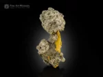 Metallic pyrite crystals on a yellow limonite matrix.