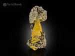 Metallic pyrite crystals on a yellow limonite matrix.