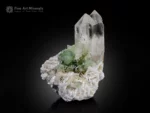 Parallel-grown quartz crystals with green herderite and muscovite on albite matrix.