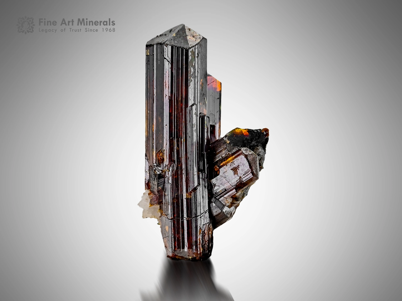 Dark metallic rutile crystal cluster with fiery red reflections from Zagi Mountain, Pakistan.