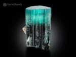 Tourmaline crystal with seafoam blue top transitioning to dark base, flat termination, vertical striations and albite.