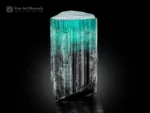Tourmaline crystal with seafoam blue top transitioning to dark base, flat termination, vertical striations and albite.