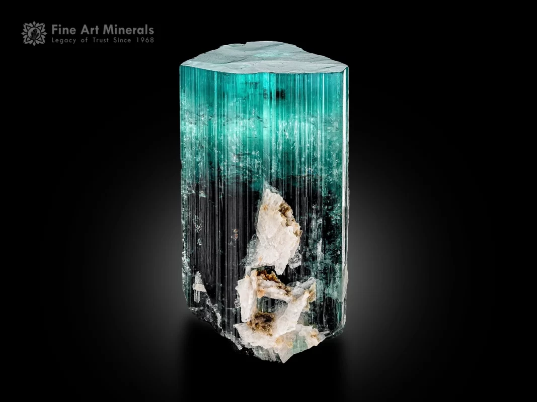 Tourmaline crystal with seafoam blue top transitioning to dark base, flat termination, vertical striations and albite.