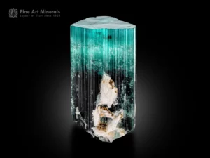 Tourmaline crystal with seafoam blue top transitioning to dark base, flat termination, vertical striations and albite.