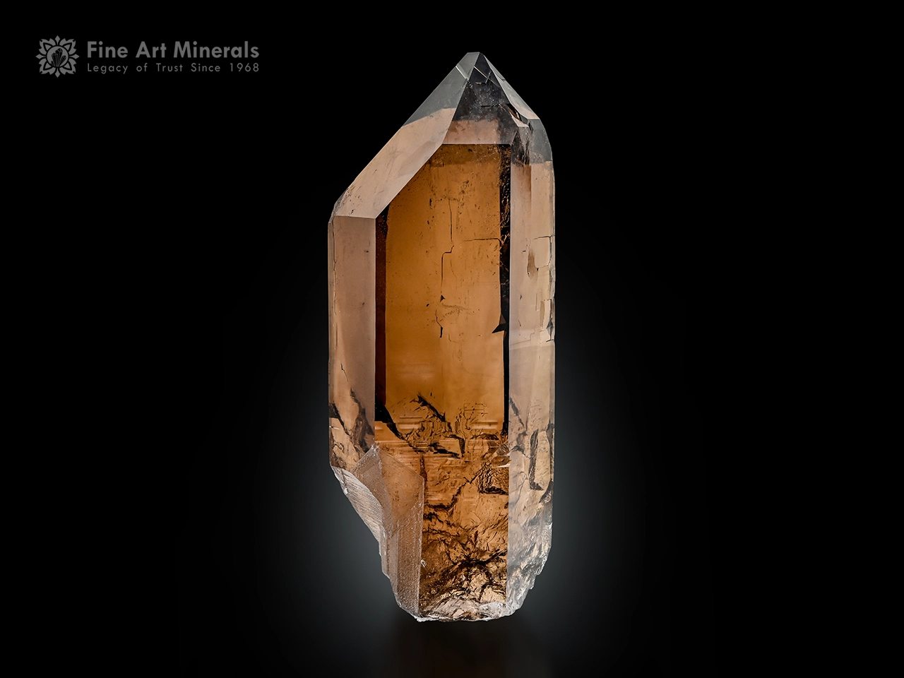 Smoky quartz crystal with excellent luster, sharp termination, and warm brown color.