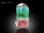 Natural tourmaline crystal with green and seafoam blue upper section transitioning to pink base, well-terminated with vertical striations.