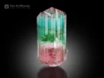 Natural tourmaline crystal with green and seafoam blue upper section transitioning to pink base, well-terminated with vertical striations.
