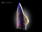 Violet-blue tanzanite crystal on matrix with sharp terminations and exceptional transparency from Merelani Hills.