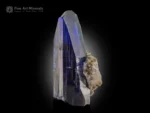 Violet-blue tanzanite crystal on matrix with sharp terminations and exceptional transparency from Merelani Hills.