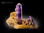 Purple amethyst quartz crystal with calcite crystals on matrix from Namibia.
