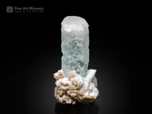 Pale blue aquamarine crystal on albite matrix with muscovite clusters and natural etched texture.