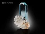 Transparent icy-blue aquamarine crystal with sharp termination on albite matrix with schorl from Shigar Valley.