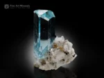 Transparent icy-blue aquamarine crystal with sharp termination on albite matrix with schorl from Shigar Valley.