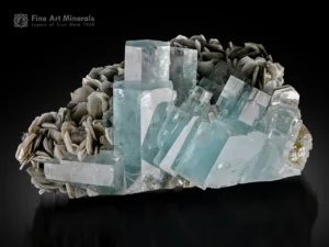 Gemmy blue aquamarine crystal cluster with muscovite matrix from Pakistan displaying excellent transparency and luster.