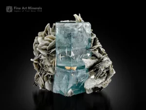 Blue aquamarine crystal with natural separation and muscovite matrix from Pakistan.