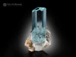 Transparent icy-blue aquamarine crystal with sharp termination on albite matrix with schorl from Shigar Valley.