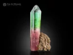 Pink and green bi-color tourmaline crystal on natural matrix from Afghanistan.