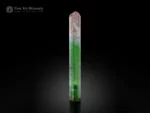 Natural bi-color tourmaline crystal with green and pink color zoning, sharp termination, and superb vertical striations.