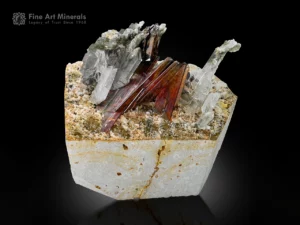 Fiery red brookite crystals with chlorite-included quartz on hard matrix.