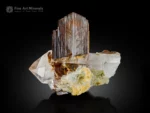 Lustrous brookite crystals associated with transparent quartz crystals on matrix.