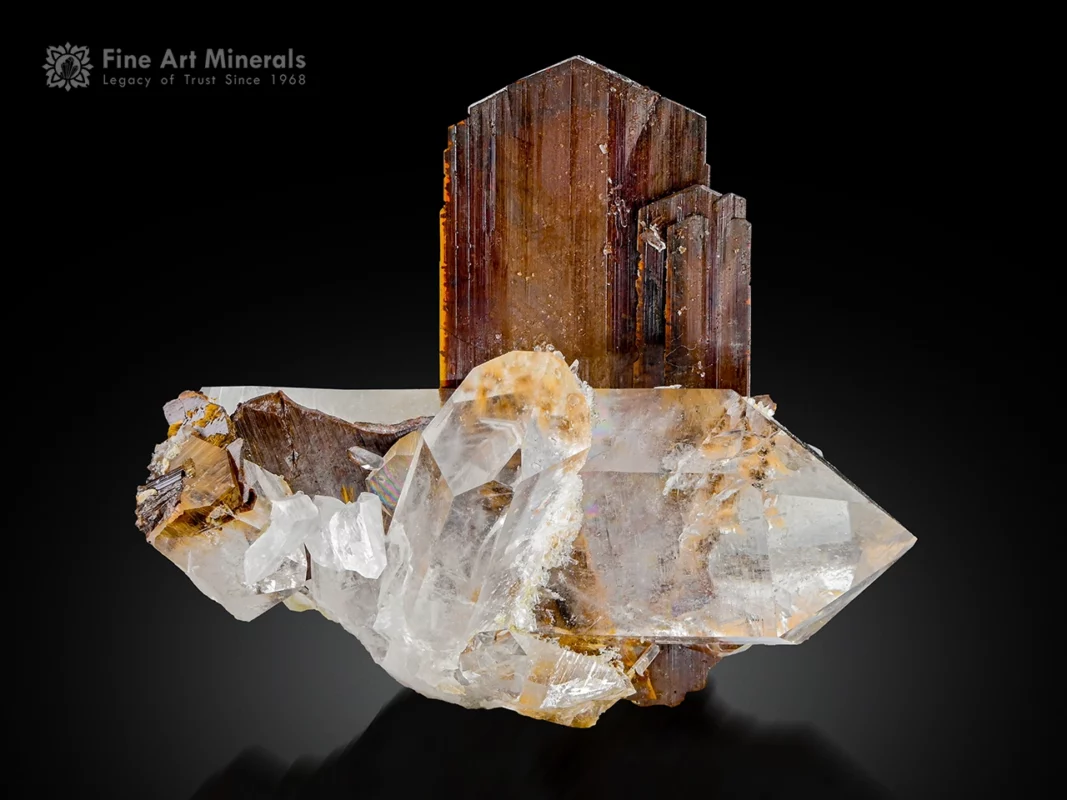 Lustrous brookite crystals associated with transparent quartz crystals on matrix.