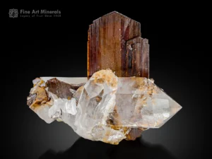 Lustrous brookite crystals associated with transparent quartz crystals on matrix.