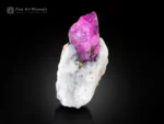 Vivid pink corundum var. ruby crystal on white matrix with pyrite from Afghanistan showing excellent color contrast.