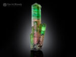 Green elbaite tourmaline cluster with pink zoning and parallel-growth crystals from Paprok Valley, Afghanistan.
