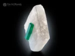 Gem-quality doubly terminated emerald crystal perched on white calcite matrix from Colombia with vivid green color and exceptional contrast.