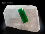 Gem-quality doubly terminated emerald crystal perched on white calcite matrix from Colombia with vivid green color and exceptional contrast.