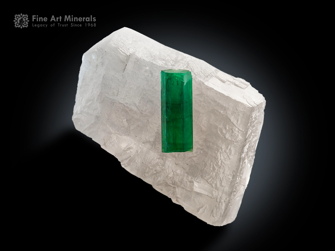 Gem-quality doubly terminated emerald crystal perched on white calcite matrix from Colombia with vivid green color and exceptional contrast.