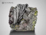 Fan-shaped epidote crystal cluster with superb luster on columbite matrix.