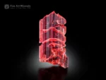 Elongated raspberry-red vayrynenite crystal with etched form and superb gem quality from Pakistan
