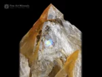 Golden window quartz crystal cluster with sharp terminations and brilliant luster.