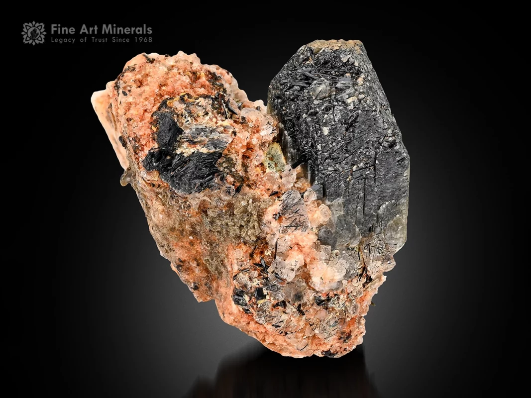 Rare hingganite crystal on textured albite matrix with contrasting dark inclusions