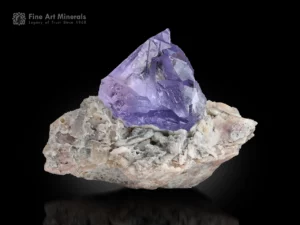 Lilac Kunzite crystal on white Albite matrix with UV fluorescence.