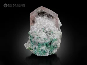 Pink morganite crystal on cleavelandite, feldspar, and green tourmaline matrix, Afghanistan.