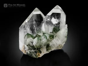 Transparent Quartz crystals with green Chlorite inclusions and sharp terminations.