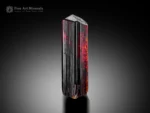 Elongated rutile crystal with fiery red internal glow from Zagi Mountain, Pakistan