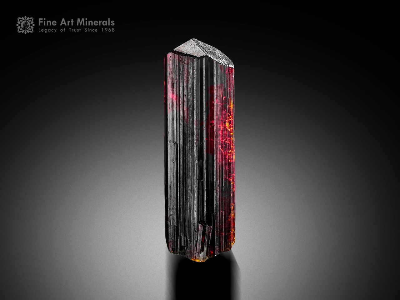 Elongated rutile crystal with fiery red internal glow from Zagi Mountain, Pakistan