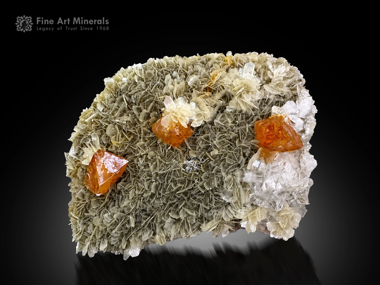 Gemmy orange Scheelite crystals on silvery-green Muscovite rosettes with Quartz from Xuebaoding.